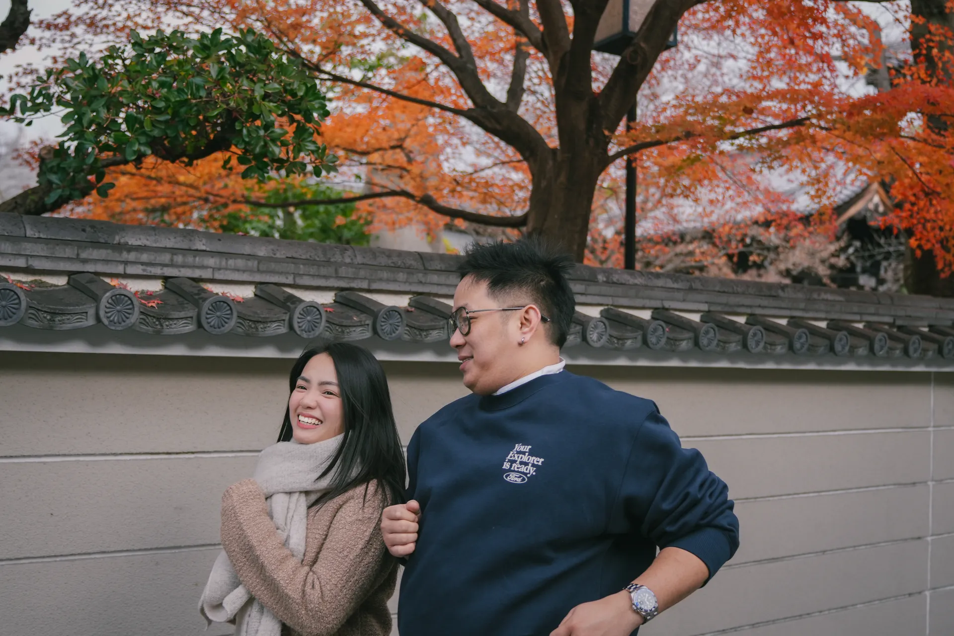 Rein and Mhae laughing along the temple wall