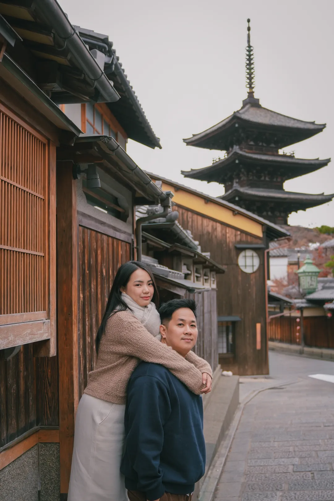 An embrace on the old street below Yasaka Pagoda